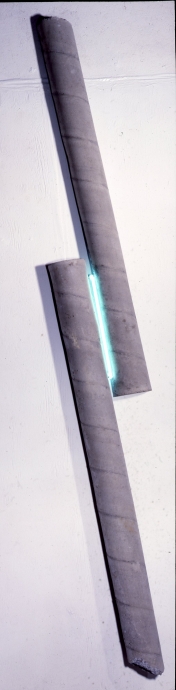 Two Bars of Concrete with a Turquoise Neon